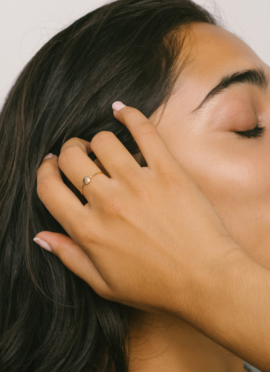 Model wearing the 14K Yellow Fairmined Ecological Gold stackable ring
