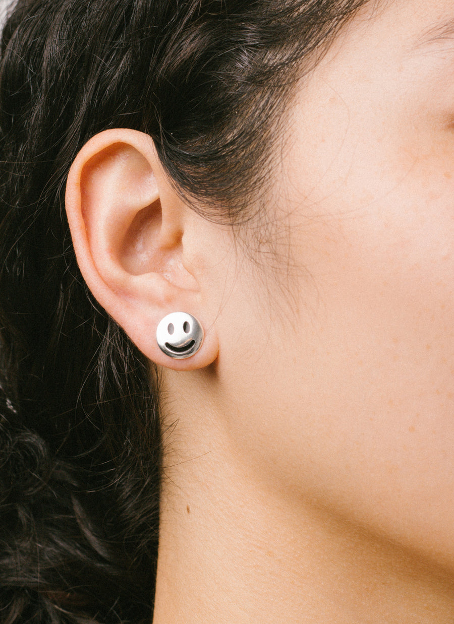 Moody stud earrings from RIVA New York in sterling silver, this shows the "smiley face" stud