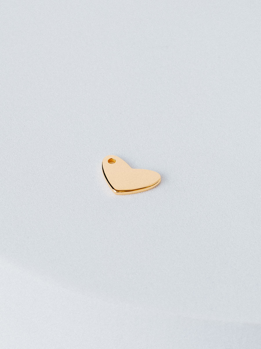 Heart shaped charm in 14K gold