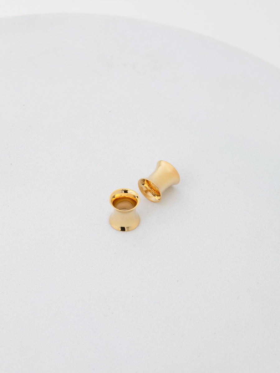 Photo of 2g double flared tunnels in 14k yellow gold from RIVA New York