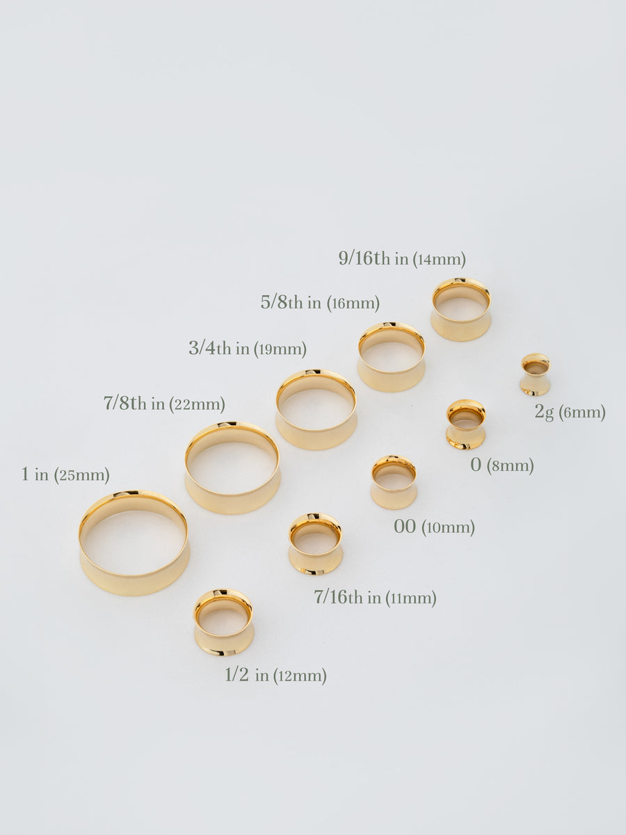Photo of the different sizes of gold tunnels for stretched ears from RIVA New York