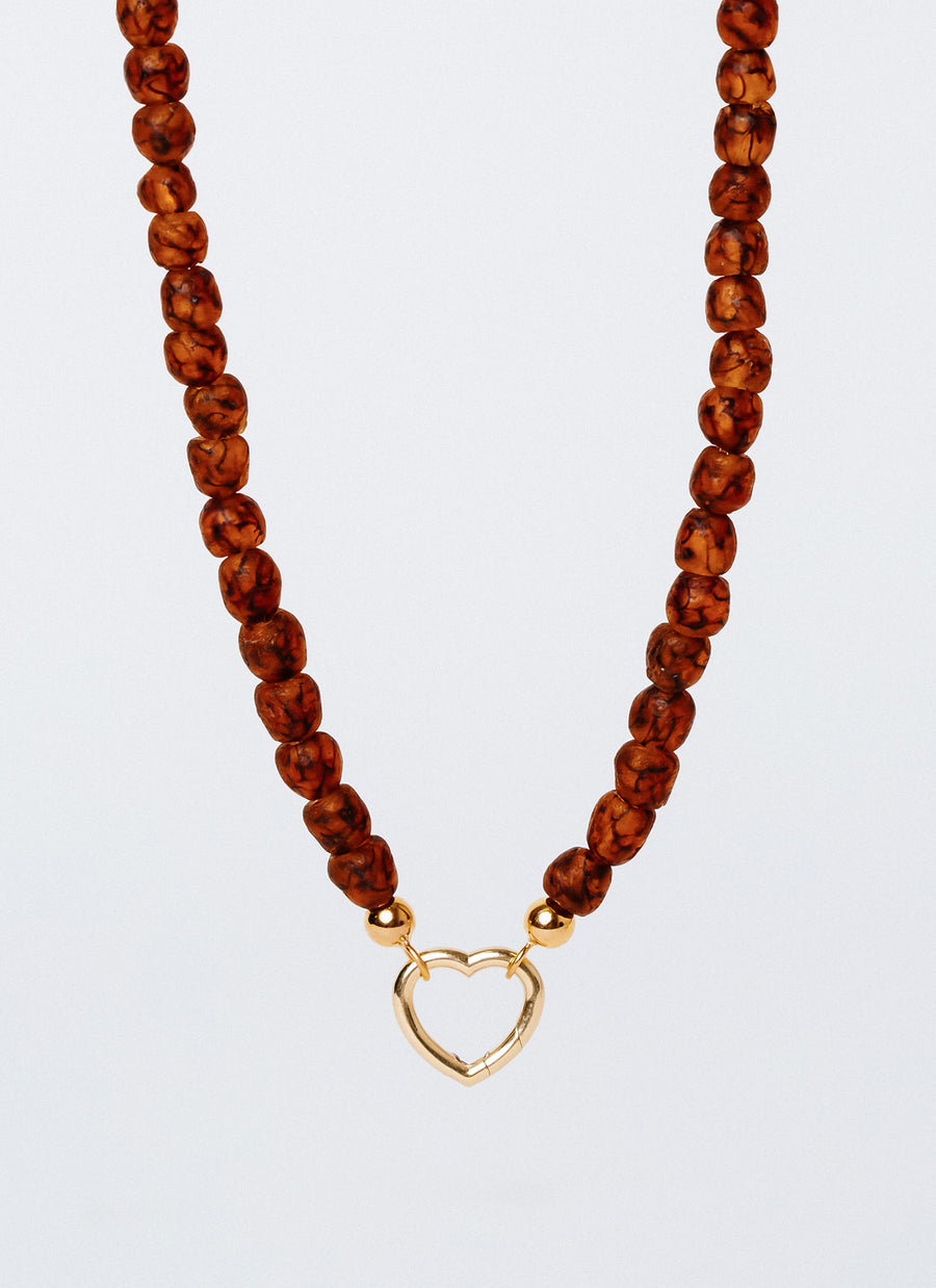 The Cobble recycled glass bead choker from RIVA New York in speckled brown and gold vermeil; this heart-shape Invisible Clasp is not included in the list price