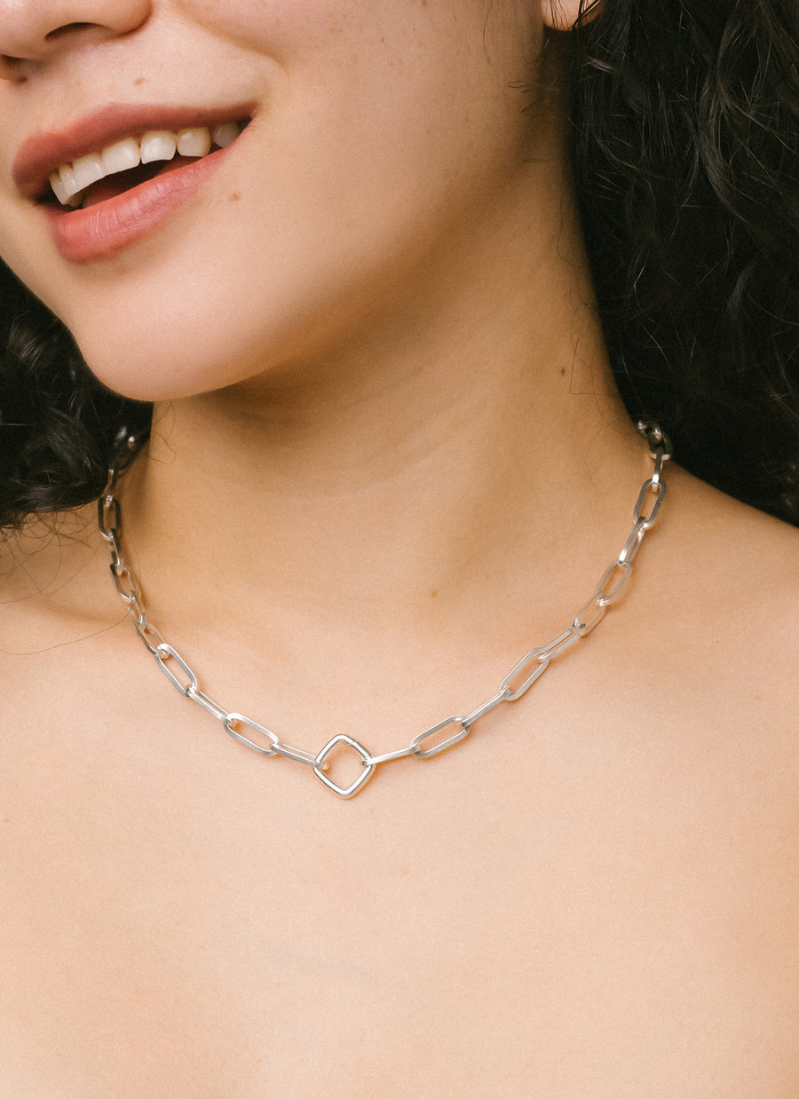Celina Santana in the Wall Street paper clip chain necklace from RIVA New York in silver, with a silver cushion clasp