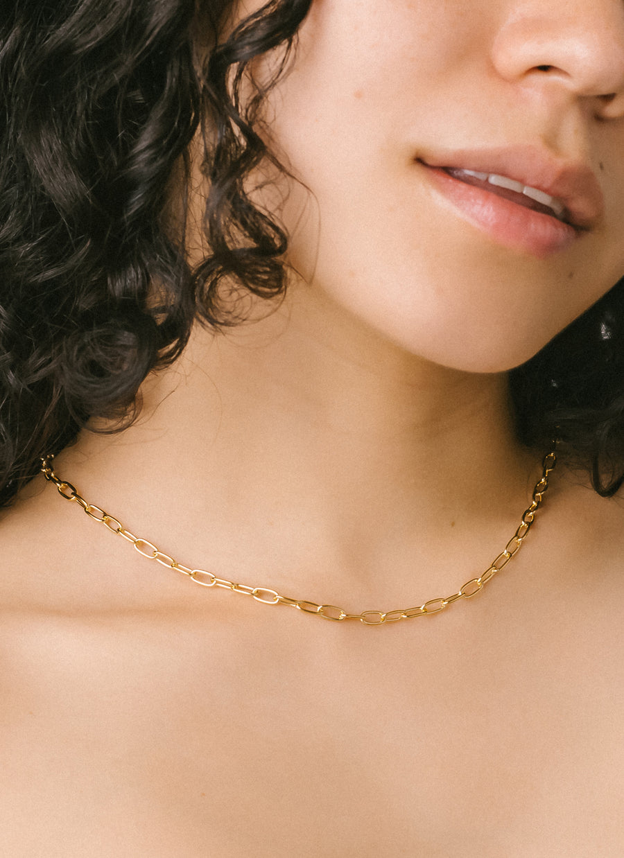 Model Celina Mylene wearing RIVA New York's gold vermeil Madison paper clip chain necklace