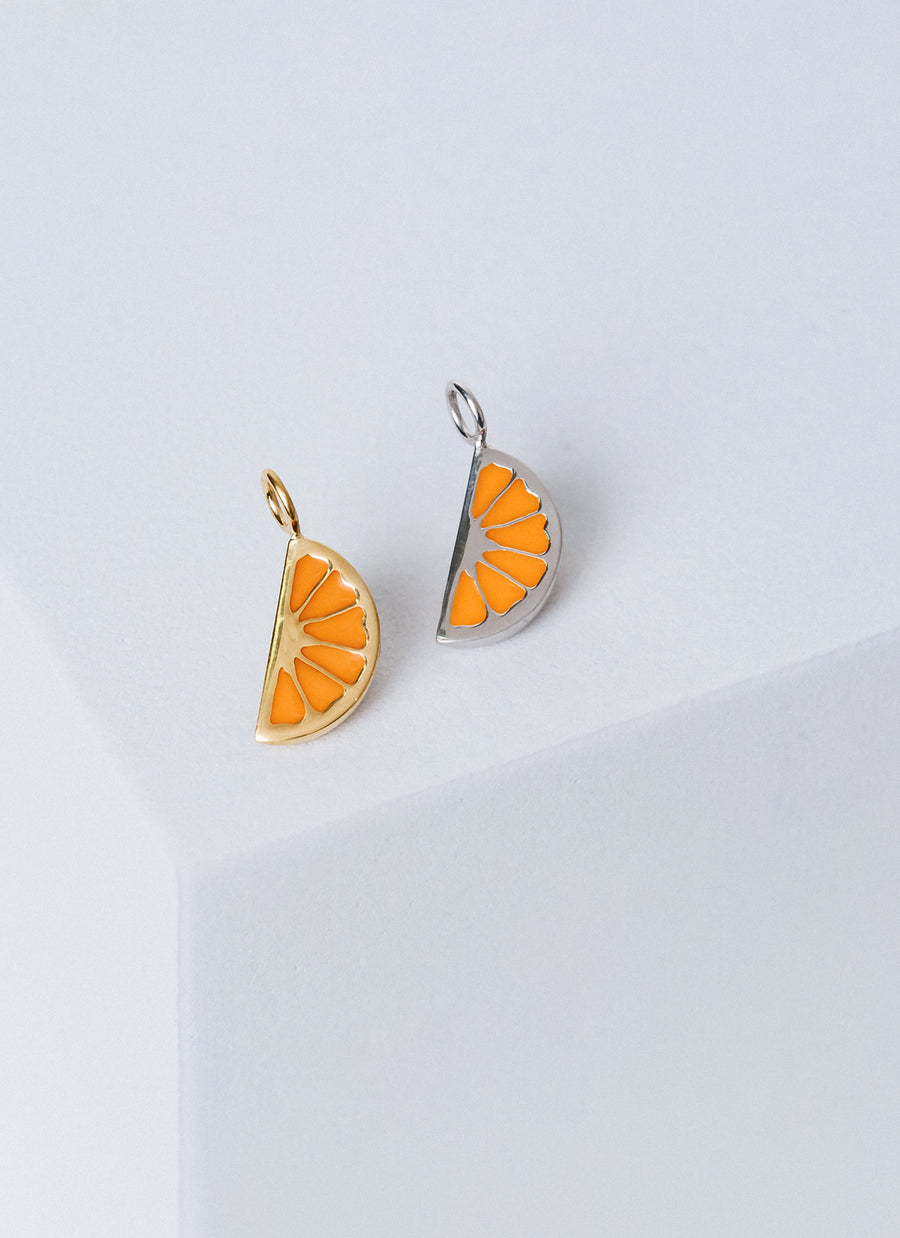 Citrus wedge enamel charms from RIVA New York in gold vermeil or sterling silver, this photo features the versions with orange enamel