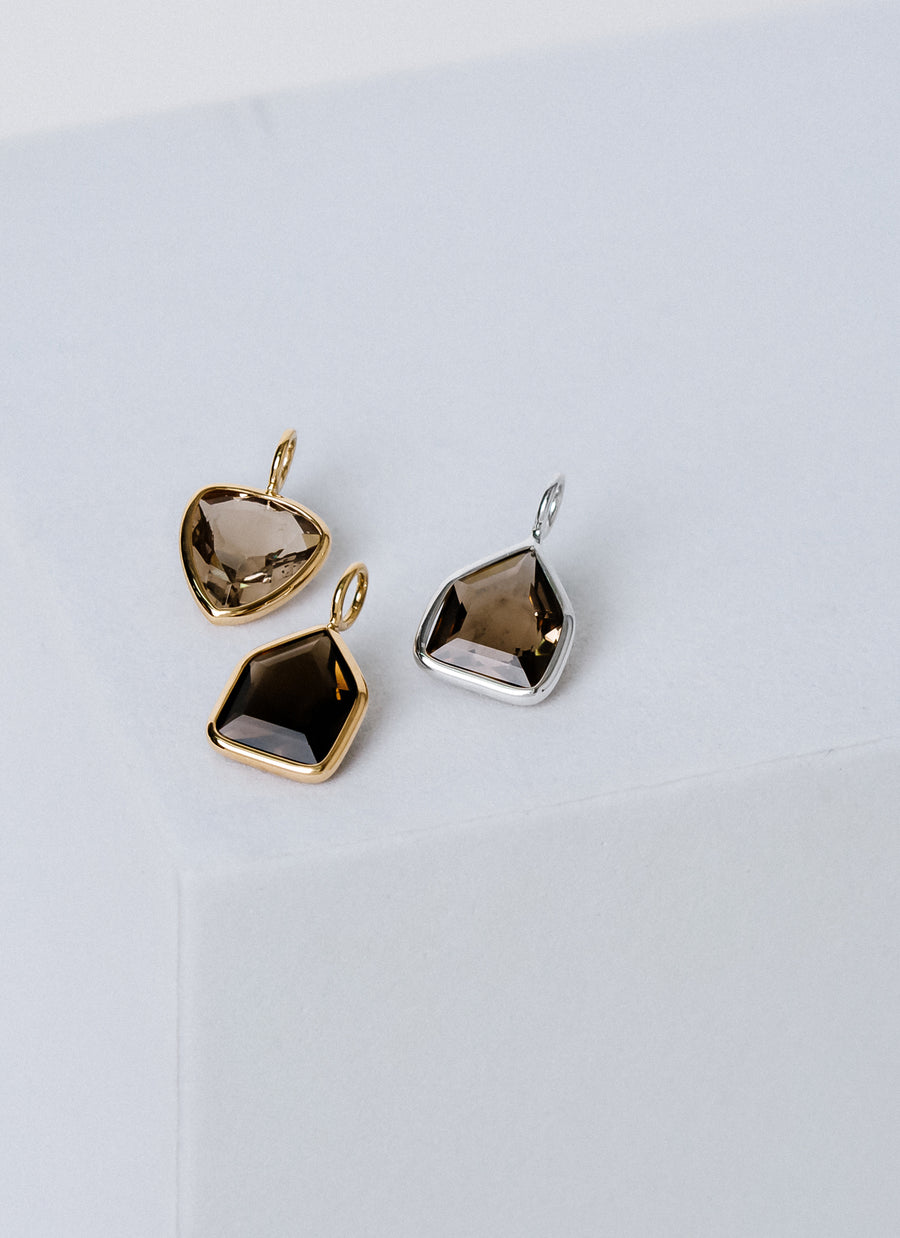 Shop RIVA New York's gemstone charms collection, featuring affordable petite semi-precious stone charms like these captivating smoky quartz charms