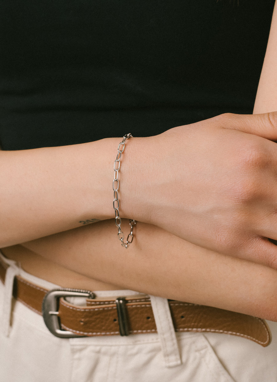 Model wearing Madison Paper Clip Chain bracelet in sterling silver from RIVA New York