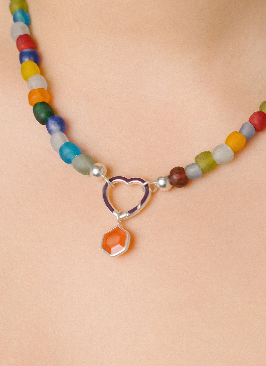 Honeycomb-shaped carnelian charm in sterling silver from RIVA New York, worn with our heart-shaped Invisible Clasp and Luna multicolor glass bead necklace