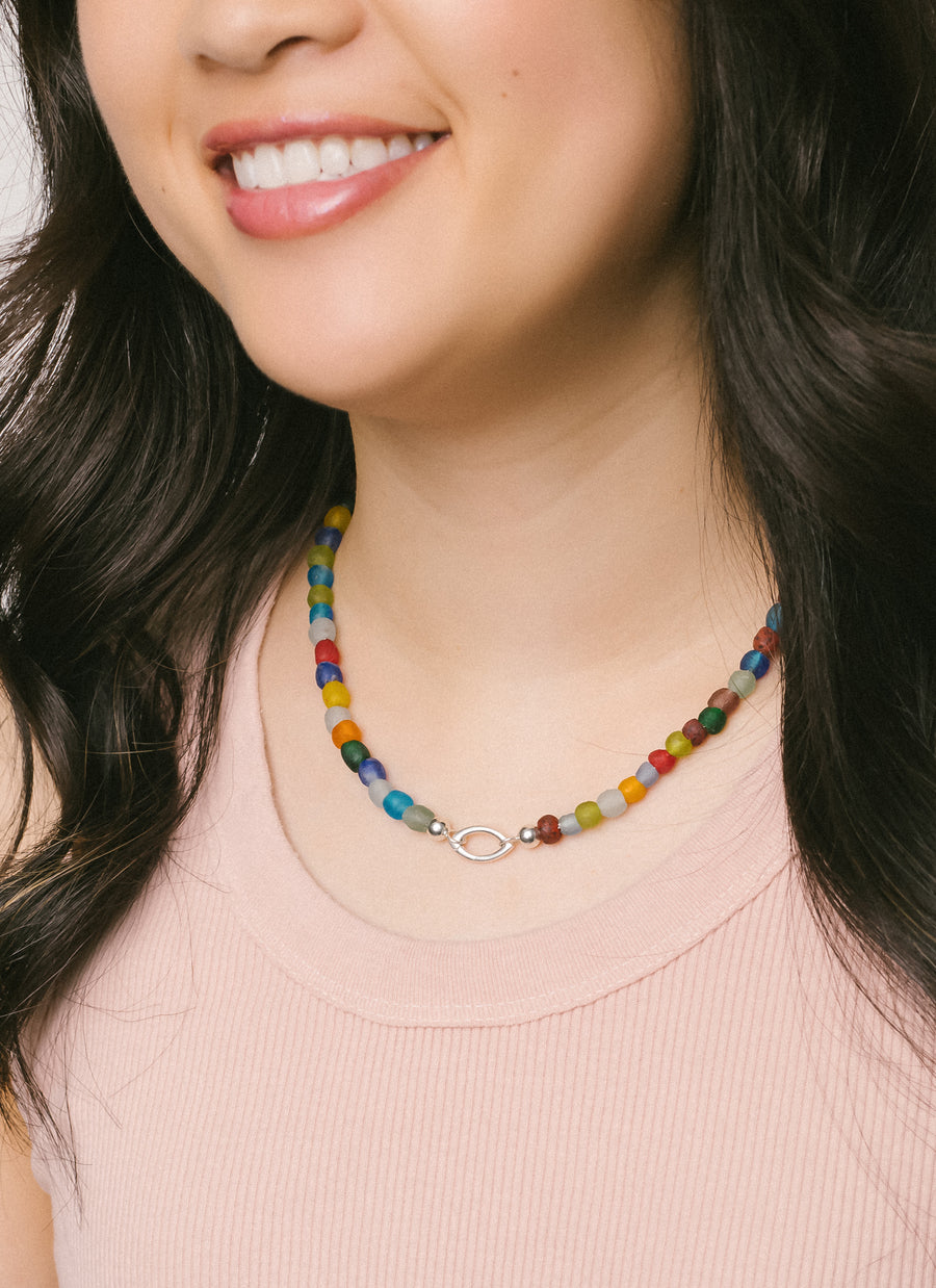 Model wears Luna multicolor recycled glass bead necklace from RIVA New York in sterling silver (marquise-shaped Invisible Clasp not included)