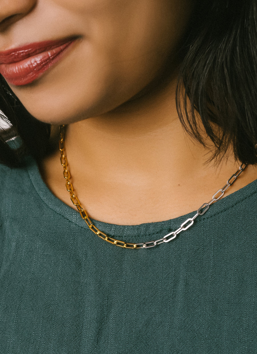 Model wearing two-tone paper clip chain necklace from RIVA New York jewelry