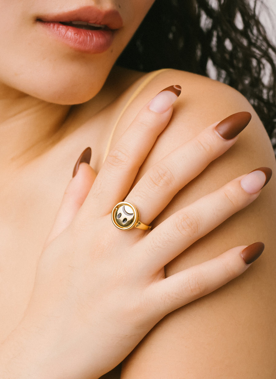 The Moody Ring from RIVA New York in gold vermeil; this photo shows the "sad face" side