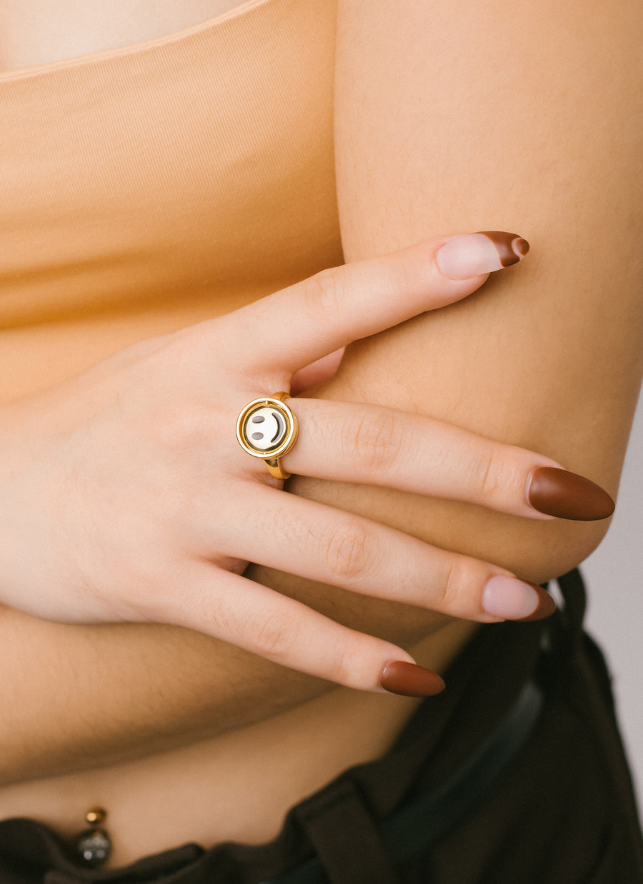 The Moody Ring from RIVA New York in gold vermeil; this photo shows the "smiley face" side