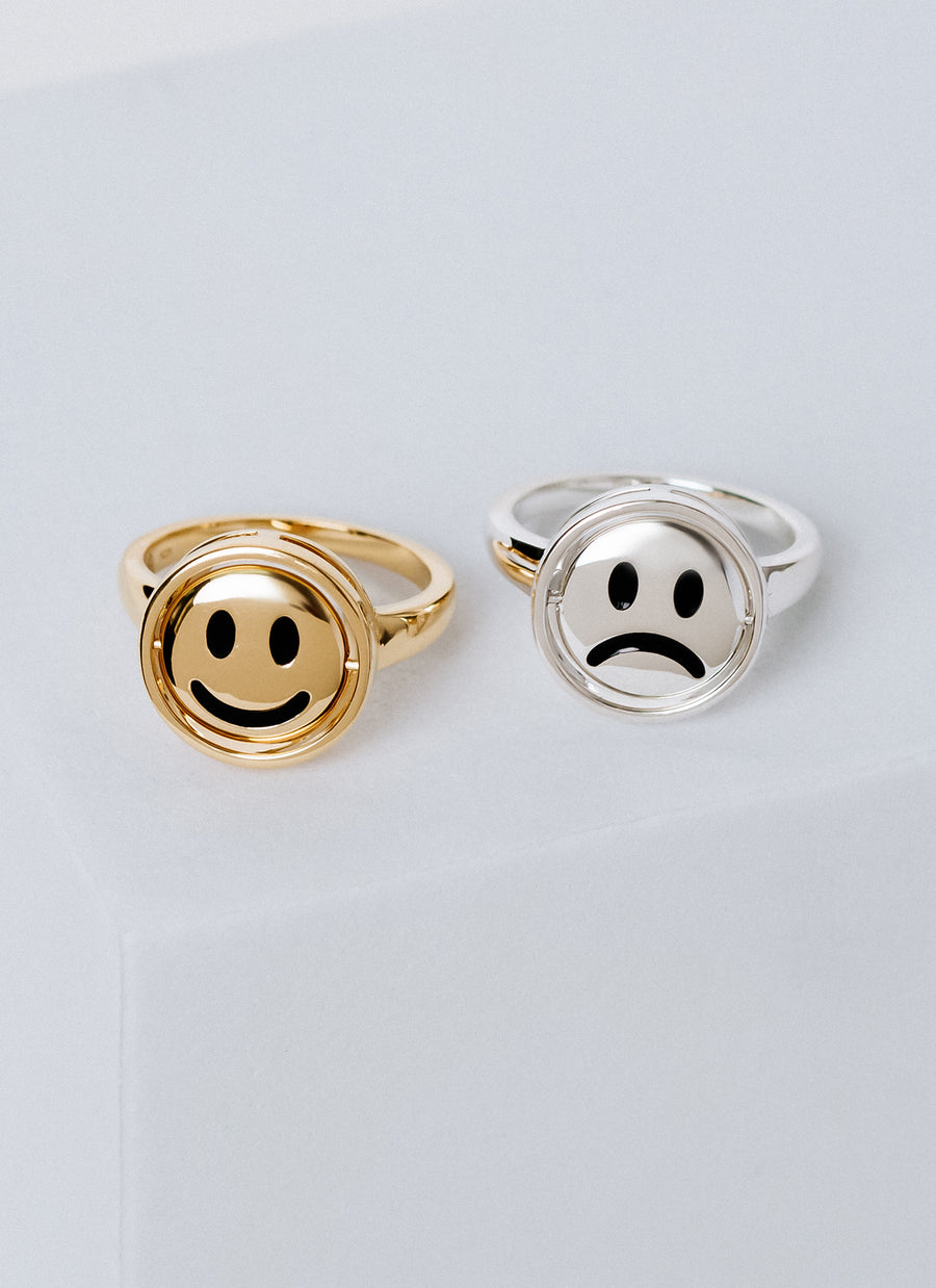 The Moody Ring from RIVA New York allows you to flip between sad face and smiley face, in silver, gold vermeil, and 14K yellow gold