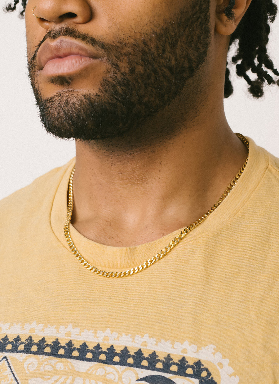 Male model wearing Bowery Curb Chain necklace in gold vermeil from RIVA New York