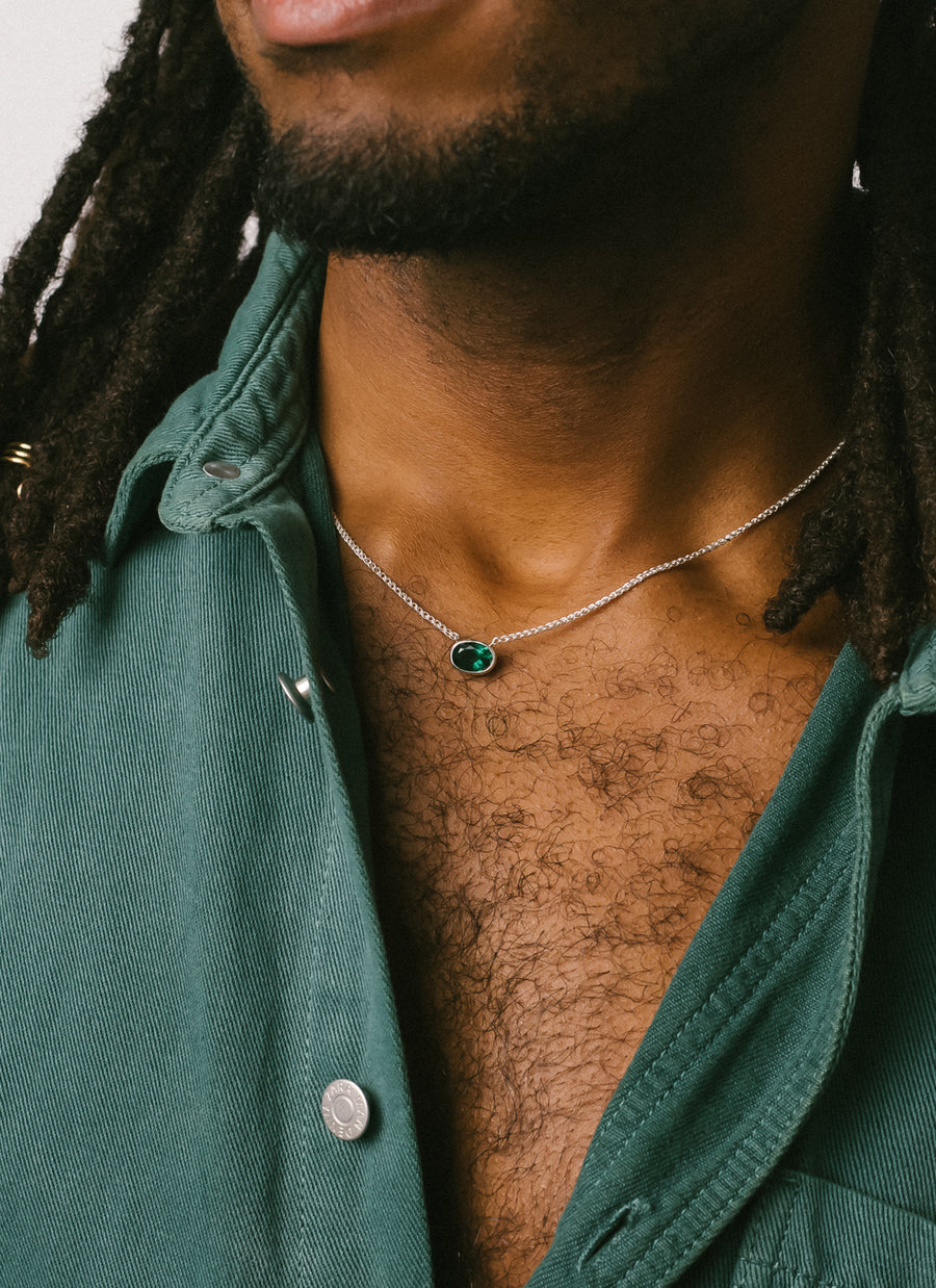 Male model wearing RIVA New York's East-West Oval Green Quartz Bezel Necklace
