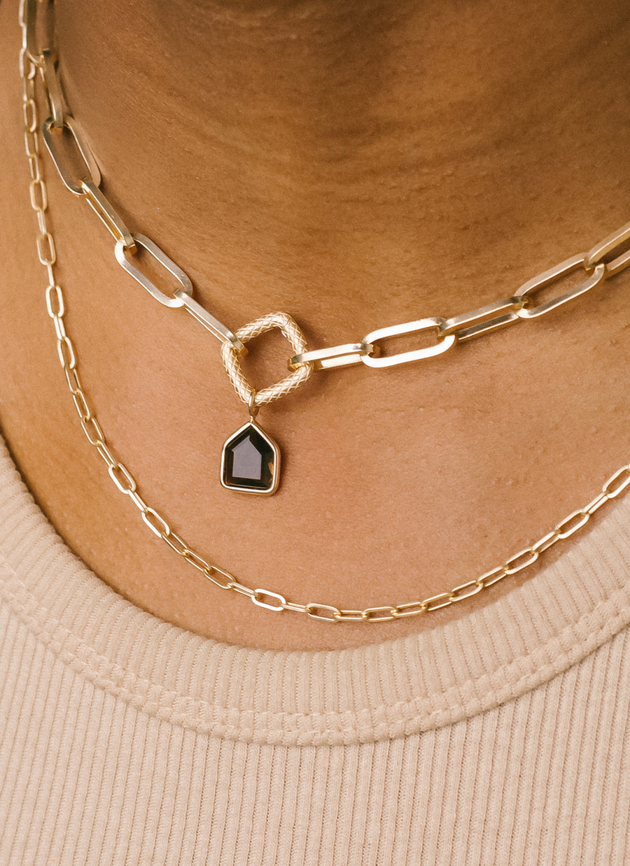 Dainty smoky quartz charm from RIVA New York for modular jewelry lovers, shown here worn as pendant