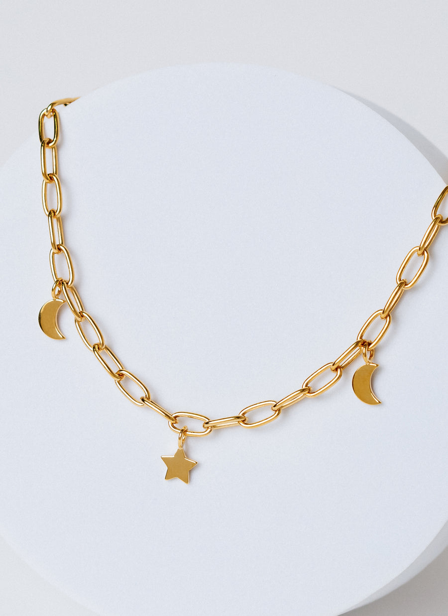 Paper clip chain necklace with star and moon charms in yellow gold vermeil, from RIVA New York's spring 2022 release