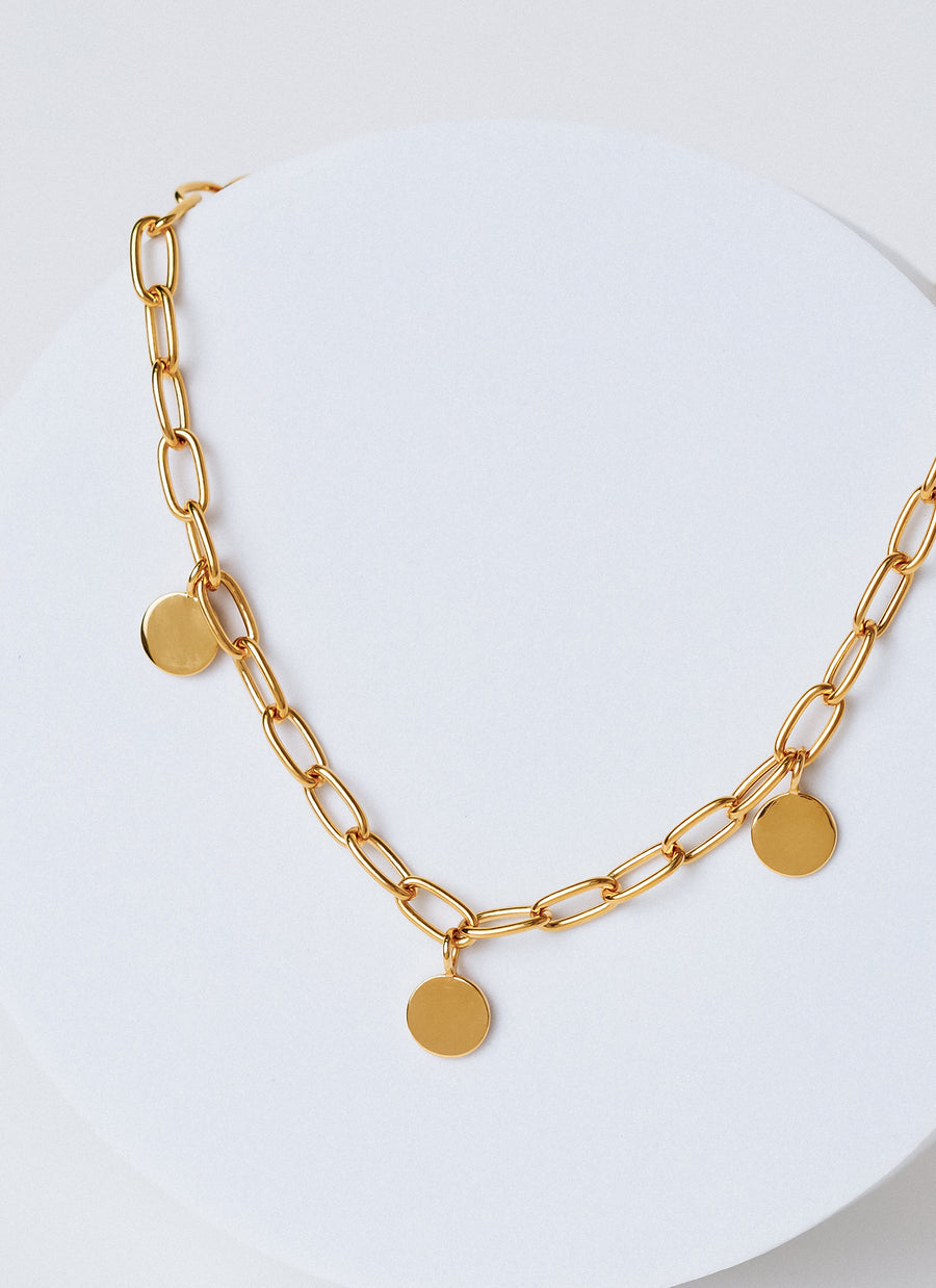 Paper clip chain necklace with round disc charms in yellow gold vermeil, from RIVA New York's spring 2022 release